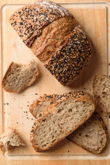 Healthy vegan dark rye sourdough bread topped with sesame and flaxseed