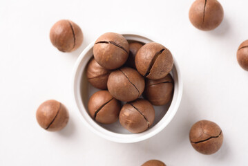 Fresh organic macadamia nuts on white background