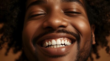 Warm close-up portrait capturing a joyful man smiling brightly in golden sunlight, highlighting expressive emotion, natural confidence, and the vibrant energy of a positive and uplifting candid moment