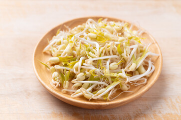 Mung bean sprouts on wooden background, Food ingredient in Asian cuisine