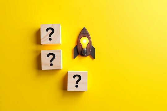 Wooden blocks with question marks surround a rocket-shaped light bulb, symbolizing innovation and problem-solving against a vibrant yellow background. - Powered by Adobe