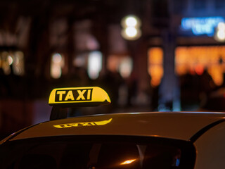 Taxi Sign Lit Up at Night in Munich City