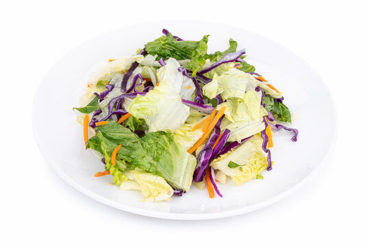 ceberg and Romaine Salad Mix on White Plate &ndash; Lettuce, Red Cabbage, and Carrots Isolated on White
