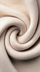 A detailed, abstract view of cream-colored knitted fabric folded into a soft, swirling spiral shape, showcasing its texture and weave.