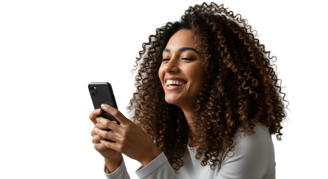 Smiling woman with curly hair using a smartphone, isolated on white background