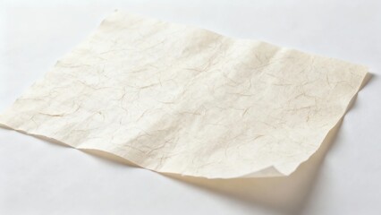 Obraz premium A crumpled sheet of off-white paper on a plain white surface
