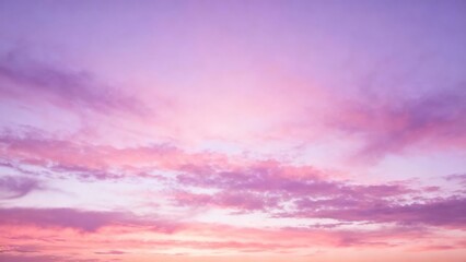 A serene sky at sunset with soft pink and purple hues blending across scattered clouds.