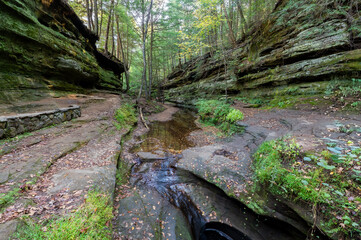 waterfall in the forest with Devils Bathtub in Hocking Hills Ohio