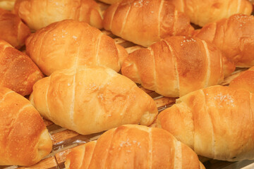 Fresh Golden Croissants on Bakery Display. concepts related to food, baking, patisserie, breakfast, and culinary craftsmanship.