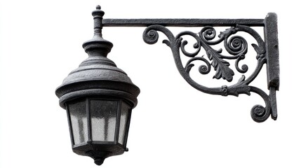 Ornate cast iron streetlamp fixture with decorative leaf and scroll arm on white background