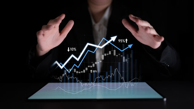 A businessperson showcases an interactive digital financial display, highlighting growth and trends with gesturing hands, emphasizing data analysis and success. Scalp