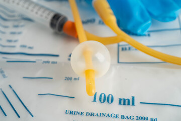 Foley catheter and urine drainage bag collect urine for disability or patient in hospital.