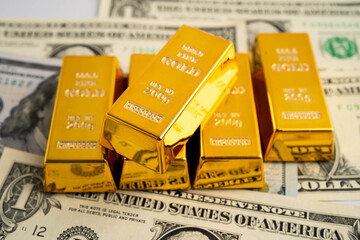 Gold bars with US dollar and Euro banknote money, finance trading investment business currency.