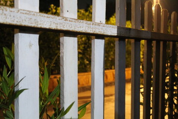 Fototapeta premium Warm Night Light on Wooden Fence