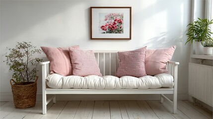 White bench with pink pillows and a floral painting in a bright room.