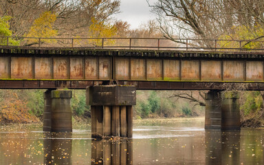 A rusty railroad bridge spans the Kankakee River in northern Indiana