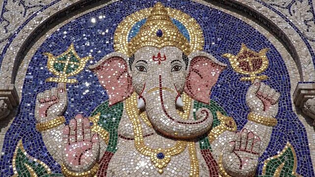 Intricate Mosaic Artwork of Lord Ganesha Adorned with Gold and Blue Hues Celebrating Ganesh Chaturthi Festival in India