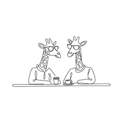 Two giraffes wearing sweaters sitting at a table