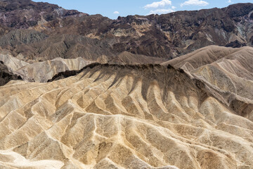 View of Zabriskie Point in Death Valley National Park in California, United States. Zabriskie Point is a part of the Amargosa Range located east of Death Valley noted for its erosional landscape.  © JHVEPhoto