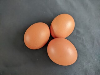 Three Raw Chicken Eggs Close Up View