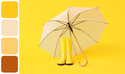 Stylish white umbrella and gumboots on yellow background
