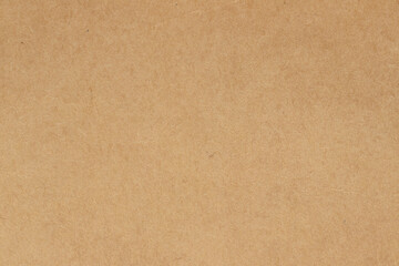 Brown cardboard sheet abstract background, texture of sepia color kraft paper with vintage pattern for design art work.