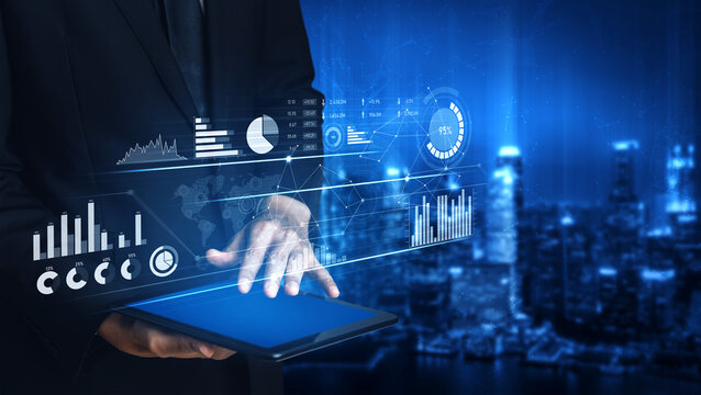 A professional businessman interacts with a tablet device displaying virtual analytics over a city skyline, representing modern technology and data-driven decision-making. Scalp - Powered by Adobe