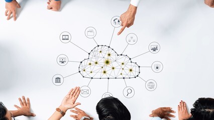 A group of diverse professionals collaborates in a meeting, utilizing a digital cloud concept on a table to discuss innovative technology solutions and strategies. Raster