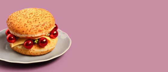 Burger with Christmas balls on color background