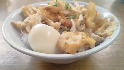 chicken porridge the traditional streetfood in Indonesia