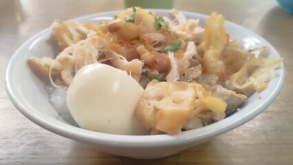 chicken porridge the traditional streetfood in Indonesia