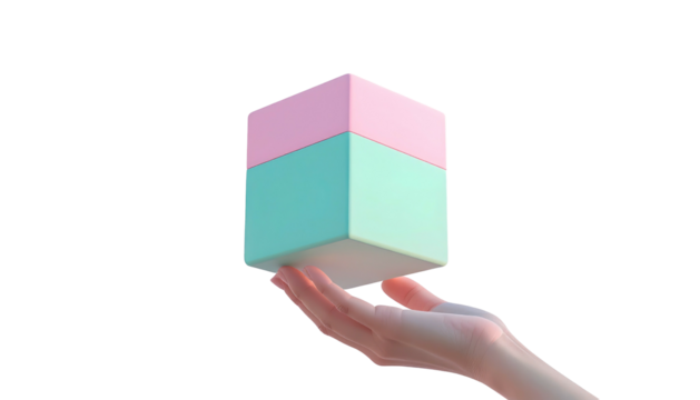 Hand holding a pastel, two-toned pink and turquoise cube, isolated on a black background with even lighting
