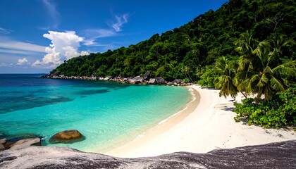 A pristine beach nestled in a bay with a crystal-clear turquoise sea, lush green hillside, and a vibrant blue sky