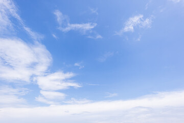 Fototapeta premium clear blue sky background,clouds with background, Blue sky background with tiny clouds. White fluffy clouds in the blue sky. 