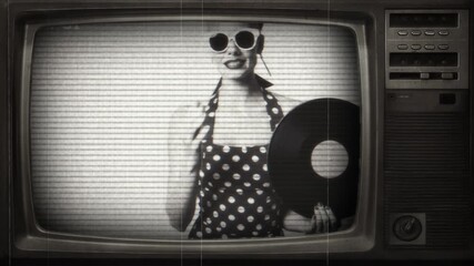 Vintage pin-up girl dancing on an old television screen