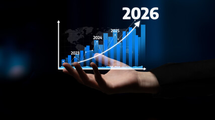 A hand displays a dynamic financial graph illustrating growth projections from 2023 to 2026,...