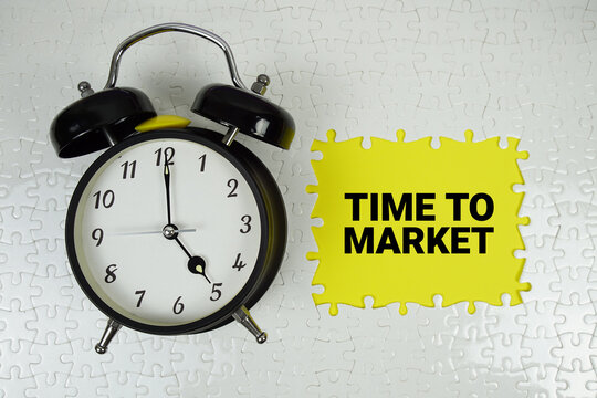 Time To Market text with alarm clock on yellow background