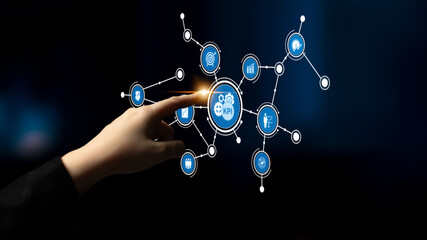 A hand interacts with a digital dashboard featuring key performance indicators and various icons, illustrating technology role in business metrics analysis and data visualization. Tessel