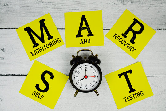 SMART Self Monitoring And Recovery Testing with alarm clock on wooden background