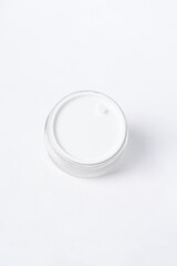A moisturizer sits on a clean white background, creating a fresh and minimalistic look