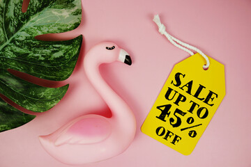 Price tag Sale 45% with summer decorations on pink background