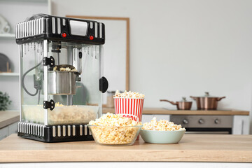 Modern popcorn machine on counter in kitchen