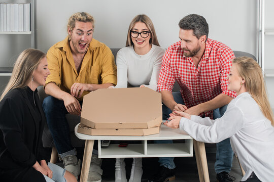 Group of friends sitting together excited to open pizza boxes. Laughter and joy fill the room as they share food. Pizza with smiles and fun. Friends enjoying delicious pizza during a cozy evening. - Powered by Adobe