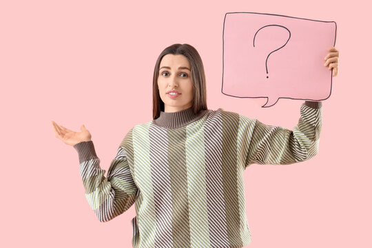 Young woman holding speech bubble with question mark on pink background - Powered by Adobe