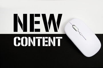 New Content text and wireless mouse on white and black background