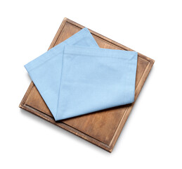 Wooden cutting board and blue napkin on white background