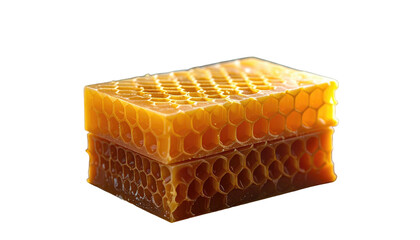 Amber-colored honeycomb block stacked on a reflective surface, against a black background