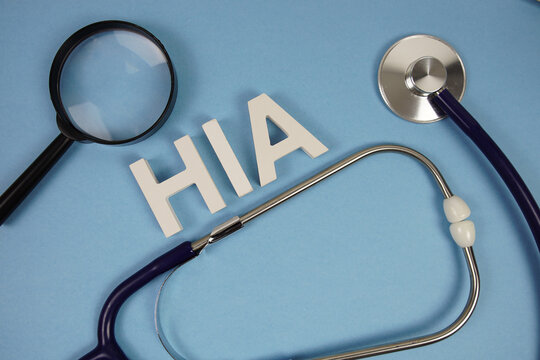 HIA abbreviation of Health Impact Assessment alphabet letters with magnifying glass and stethoscope on blue background - Powered by Adobe