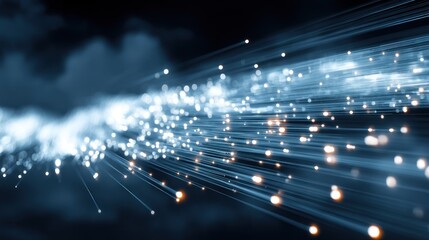 A stream of light and particles against a dark background, with a blue hue and a sense of motion.