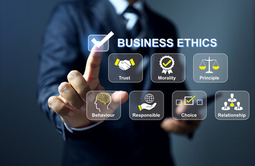 Business ethics concept with businessman pointing on checkmark represents to implement ethics in business activities to comply with the law and corporate governance of the company